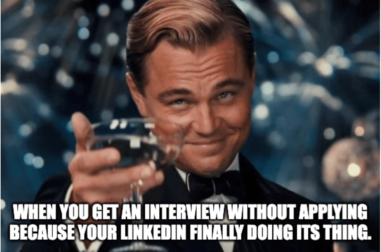 Leonardo di Caprio raises a glass with a smirk, festive background. Text: "When you get an interview without applying..." Mood: triumphant.